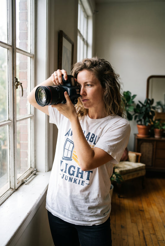 Available Light Junkie tee by a window, lifestyle
